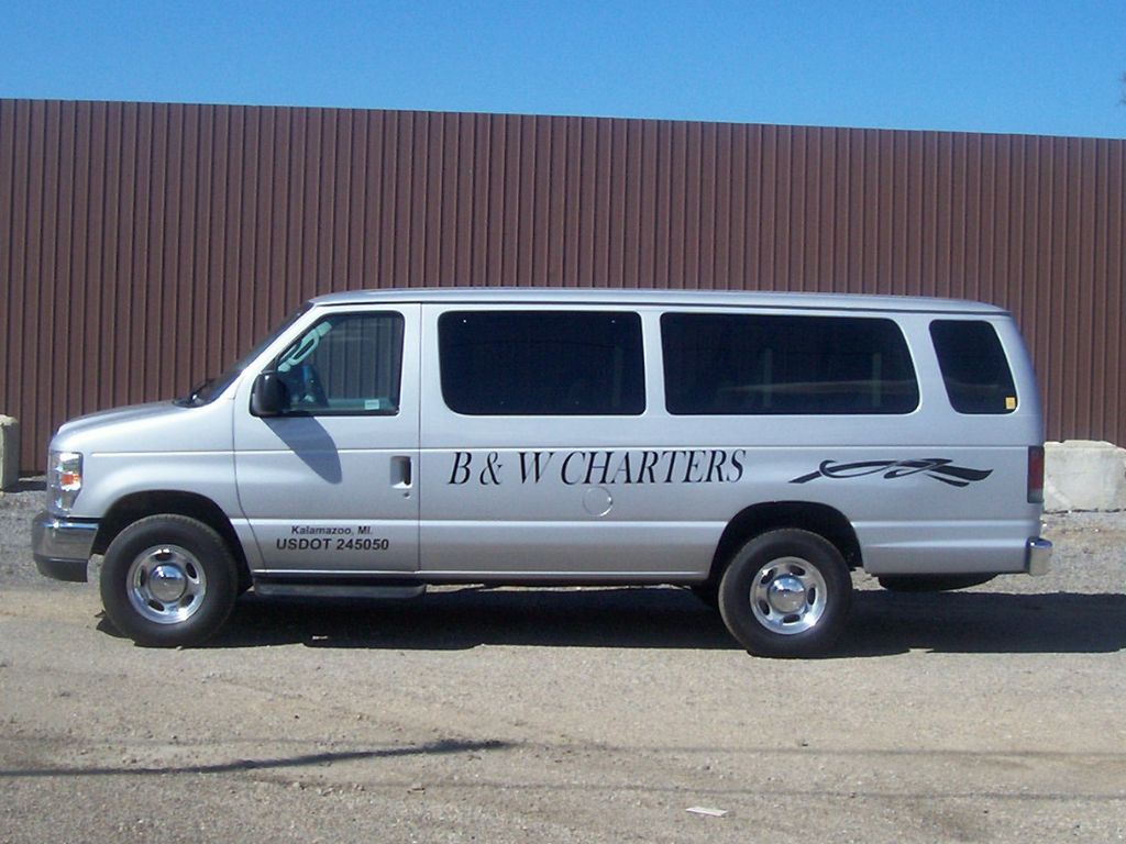 Silver B and W Charters passenger van