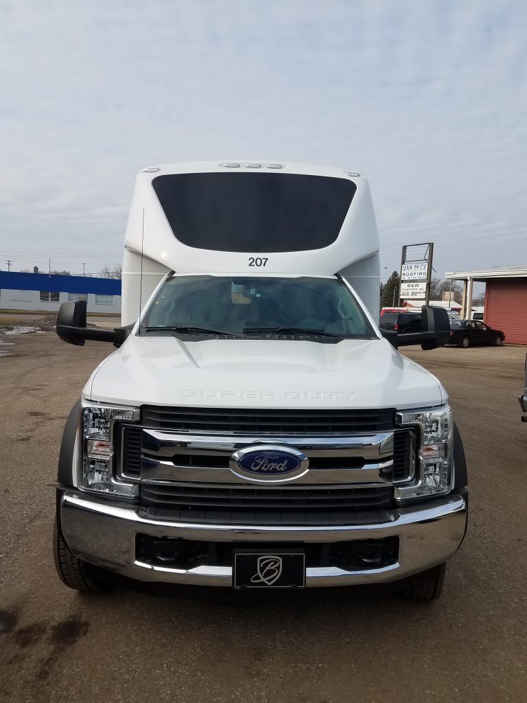 Front view of white Ford shuttle bus